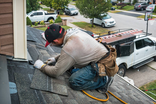 Professional Roofing technician working in Wyandanch, NY